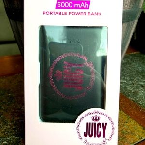 Juicy Couture portable power bank in black and pink.